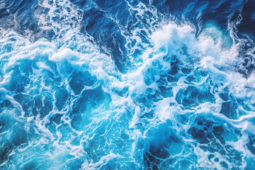 Obraz premium blue sea water with white foam for background view high above