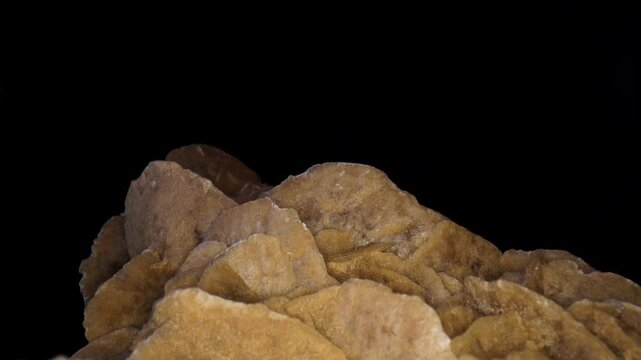 Dolly in, close-up, macro fly over the surface of the desert rose, rose-like formation of crystal clusters of gypsum.
