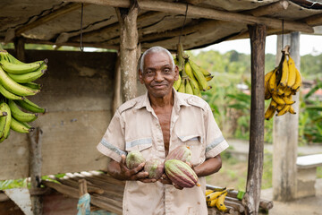 A happy farmer with cacao in his hands