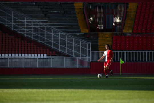 Football Player Dribbling Near Corner Flag During Training