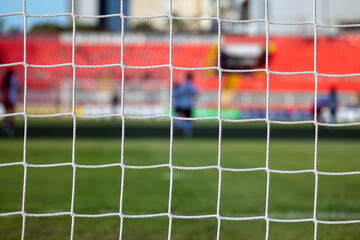 Blurred View Through Football Goal Net During Training