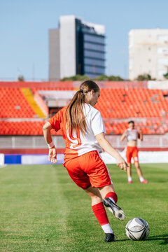 Soccer Player Passing the Ball