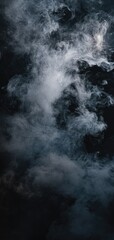 Fototapeta premium Mysterious wisps of smoke dance in dark shades of grey and silver against a deep black background, creating a cinematic ambience