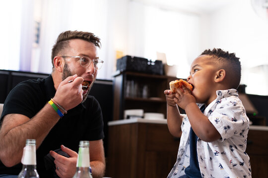 Father and Son Enjoying a Meal Together