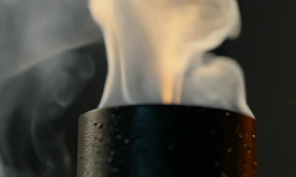macro view of smoking rifle barrel with ejected shotgun shells