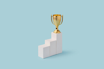 Pedestal with shiny cup on first place on blue background