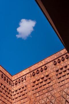 Brick walls corners flaming sky with one cloud