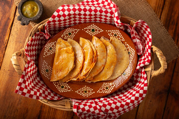 Tacos de Canasta, "basket tacos" also known as Tacos Sudados, are a typical fast food from Mexico. They are made with corn tortillas and can be filled with potatoes, beans, mole, adobo or pork rinds.