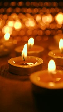 All Saints' Day greeting banner with bokeh effect. All Hallows' Day. Solemnity of All Saints. Candles with fire on shiny background	