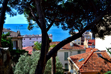 Cannes, France - September 7th 2024 : Beautiful cityscape of Cannes from the castle, with a point of view on the sea. You can see some boats on the sea.