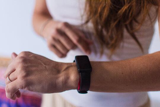 Anonymous woman using wearable technology