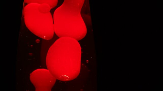 Close up footage on red colored lava lamp.