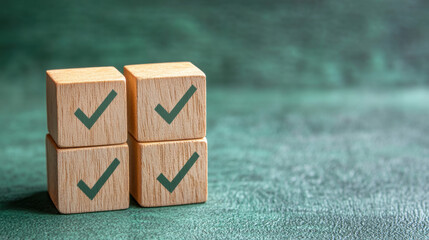 Checklist concept with copy space. Wood cubes with check marks on green background.
