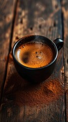 A steaming cup of black coffee on textured wood, ideal for a cozy moment