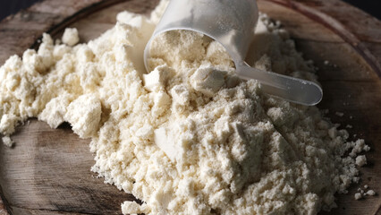 Scoop with whey protein powder