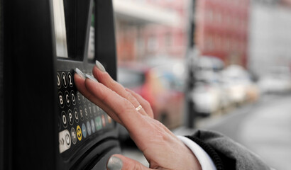 Girl Typing Car Number Into Street Parking Payment Machine