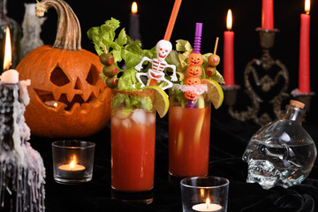 Bloody Mary cocktail. Tomato juice and vodka, garnished with celery stalk, lime and olives. Halloween party ideas.  