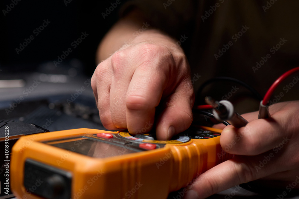 Poster hands engaged in working with various electronic components and multimeter testing processes