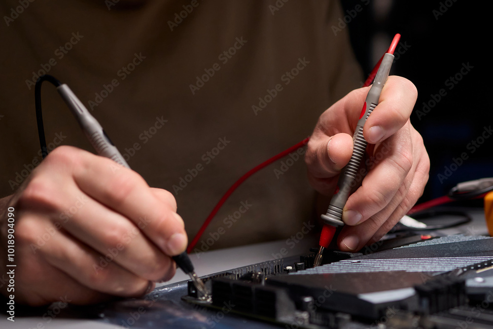 Poster Hands Engaged in Working with Various Electronic Components and Multimeter Testing Processes