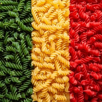 Fusilli pasta in Italian flag colours background imaga