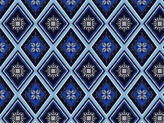 Intricate blue and white geometric pattern featuring diamond shapes and floral motifs, perfect for textiles or wallpaper designs.  Seamless Pattern paint lines