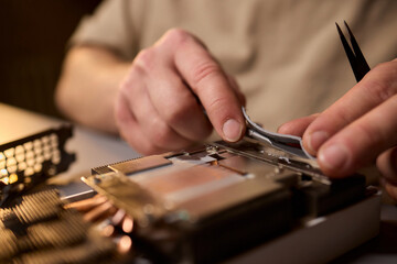 Hand Repairing a Graphics Card through the Application of Thermal Paste for Better Performance