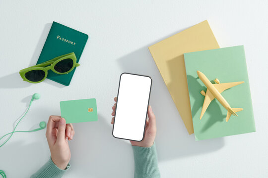 Travel concept with women's accessories and passport on white