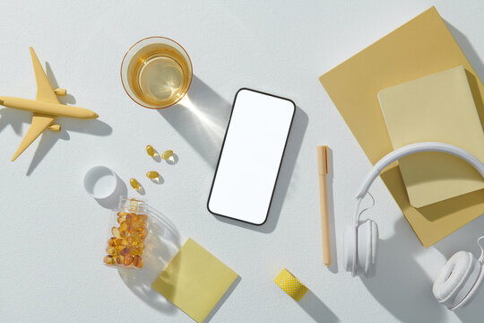 Travel blogger diary writing accessories equipment on white desk