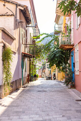 Wander through Nafplio's picturesque streets adorned with colorful buildings and lush vines. This tranquil setting invites exploration and appreciation of its unique charm.