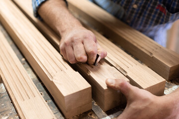 The carpenter sanded fine details in the oak part with sandpaper
