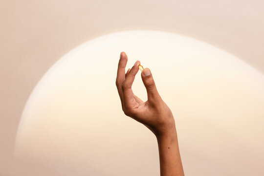 Relaxed Hand Holding Pill