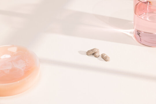 Prenatal Pills Next to Glass of Water 
