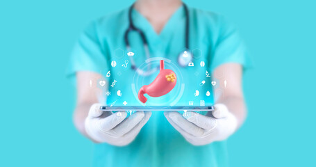 Doctor examines stomach with cancerous tissue through hologram and medical icons ....