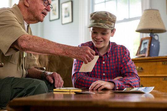 Senior Veteran family Great Grandfather  Looking at photos 