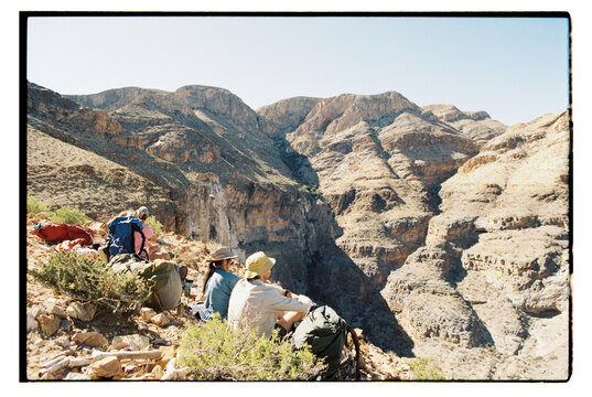 Hikers look over mountains