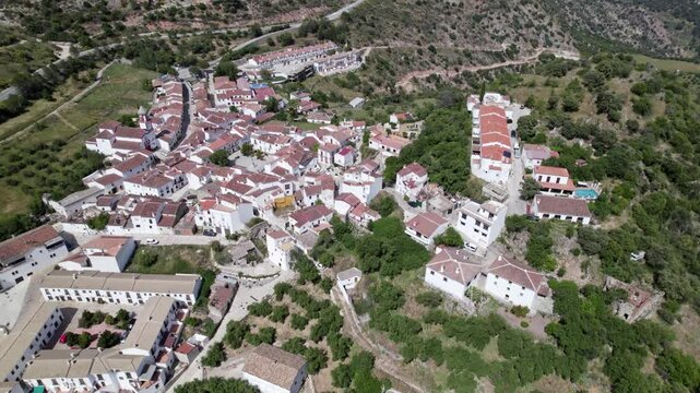 Gorgeous Aerial Shot of a Charming Mountain Village Surrounded by Hills and Traditional Houses, Atajate, Malaga, Andalucia, Spain