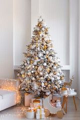An Elegant Christmas Tree beautifully positioned in a Modern Living Room, adorned with Gifts