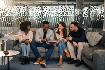 Team of diverse ecology engineers discussing clean energy development.