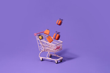 Colorful Halloween Gifts In Shopping Cart On Purple Background
