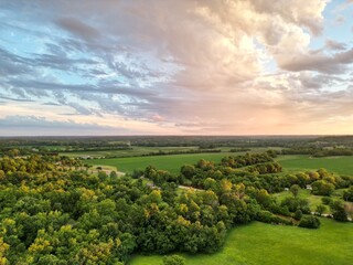 landscape with clouds and trees in missouri at sunset