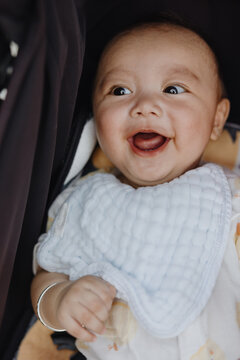 Smiling Baby in Stroller