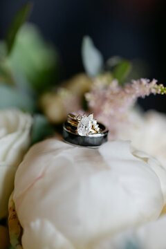 Diamond Wedding Ring Sitting on Rose Petals