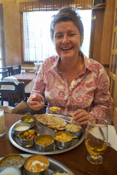 Tourist in India enjoying Tali Plate