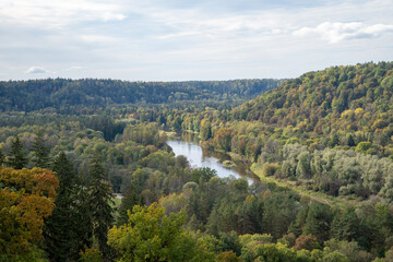 River flows through the river valley. Gauja ancient Valley. A wonderful autumn landscape.