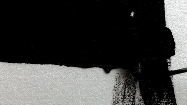 white wall painted black with a roller