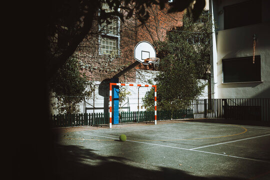 Empty Sports Court with Basketball Hoop