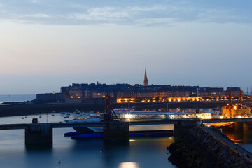Night view of walled city Saint-Malo with St Vincent Cathedral, famous port city of Privateers is...