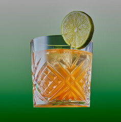 Whisky cocktail garnished with a slice of lime.