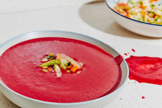 beetroot spanish gazpacho topped with cut vegetables