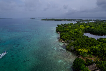 Obraz premium Aerial view of the beautiful Bora Bora island and Island de Rosario turquoise waters, Resorts and yachts in Cartagena.